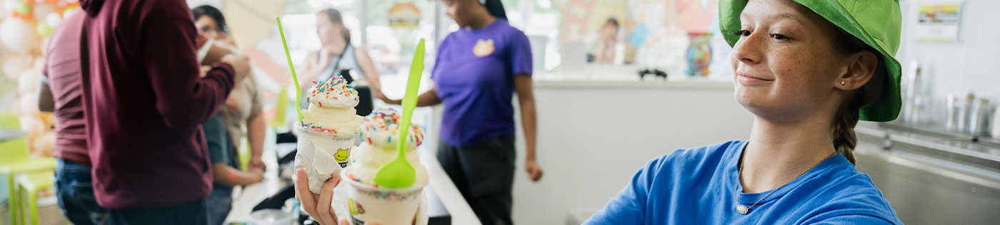 jeremia's ice cream shop worker with ice cream cups in Pasadena, TX