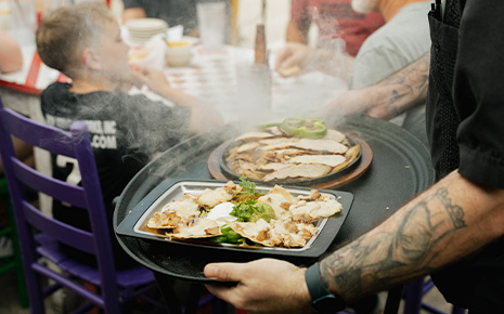 Man holding tray of restaurant food